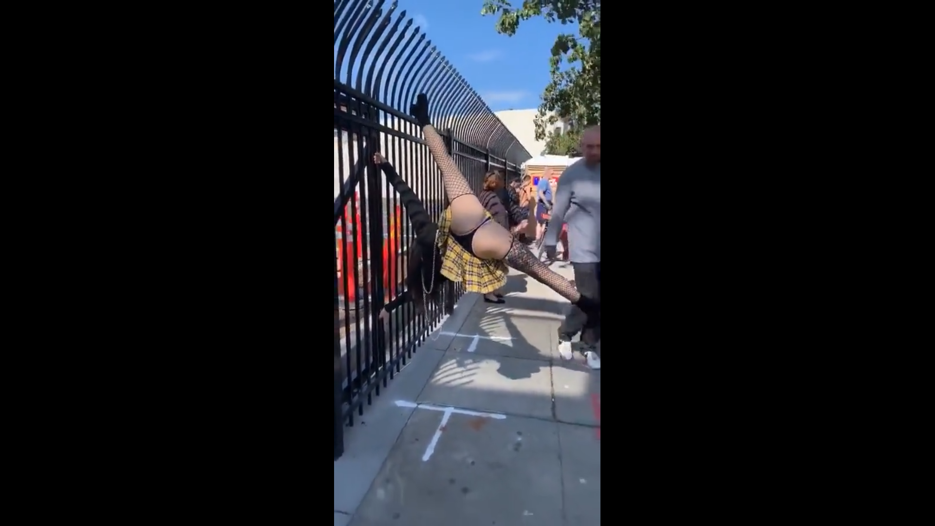 Young girl doing acrobatics in public
