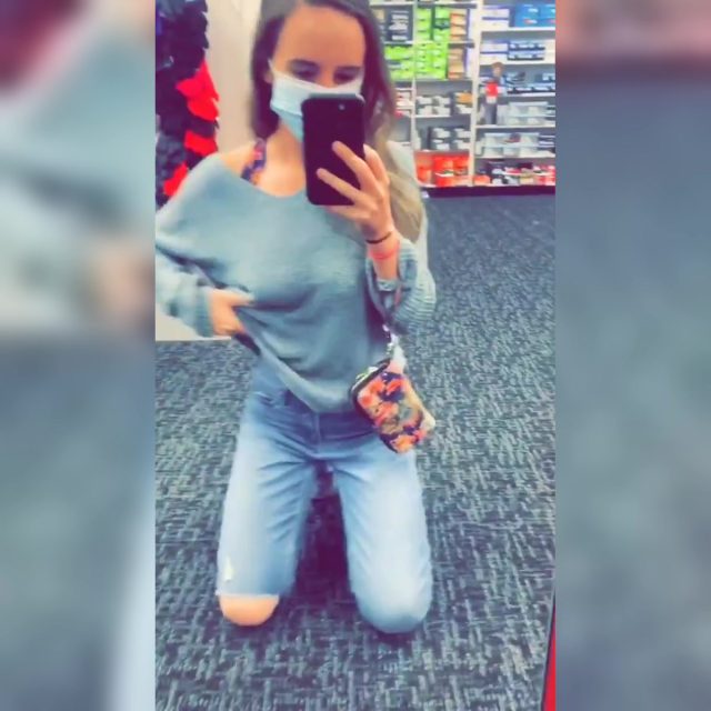 Woman Briefly Flashes Her Breasts in a Shoe Store